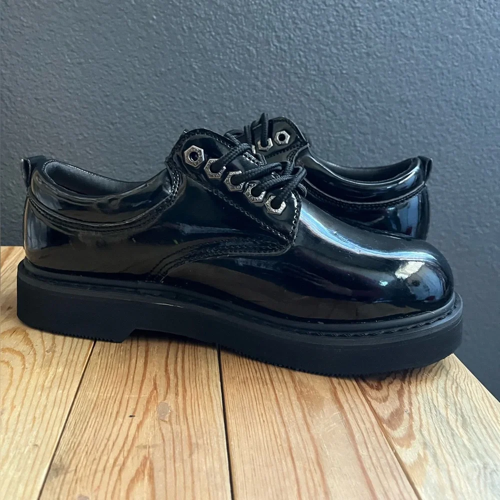 All black leather platform low top laced up boots